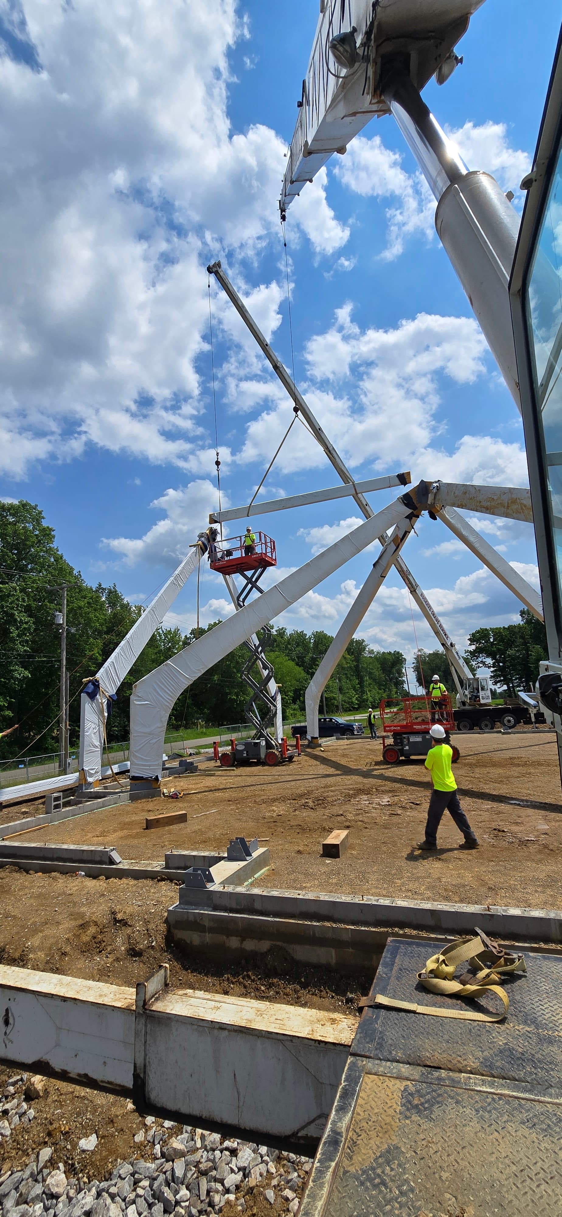 Close-up of rigging work with crane operator on site